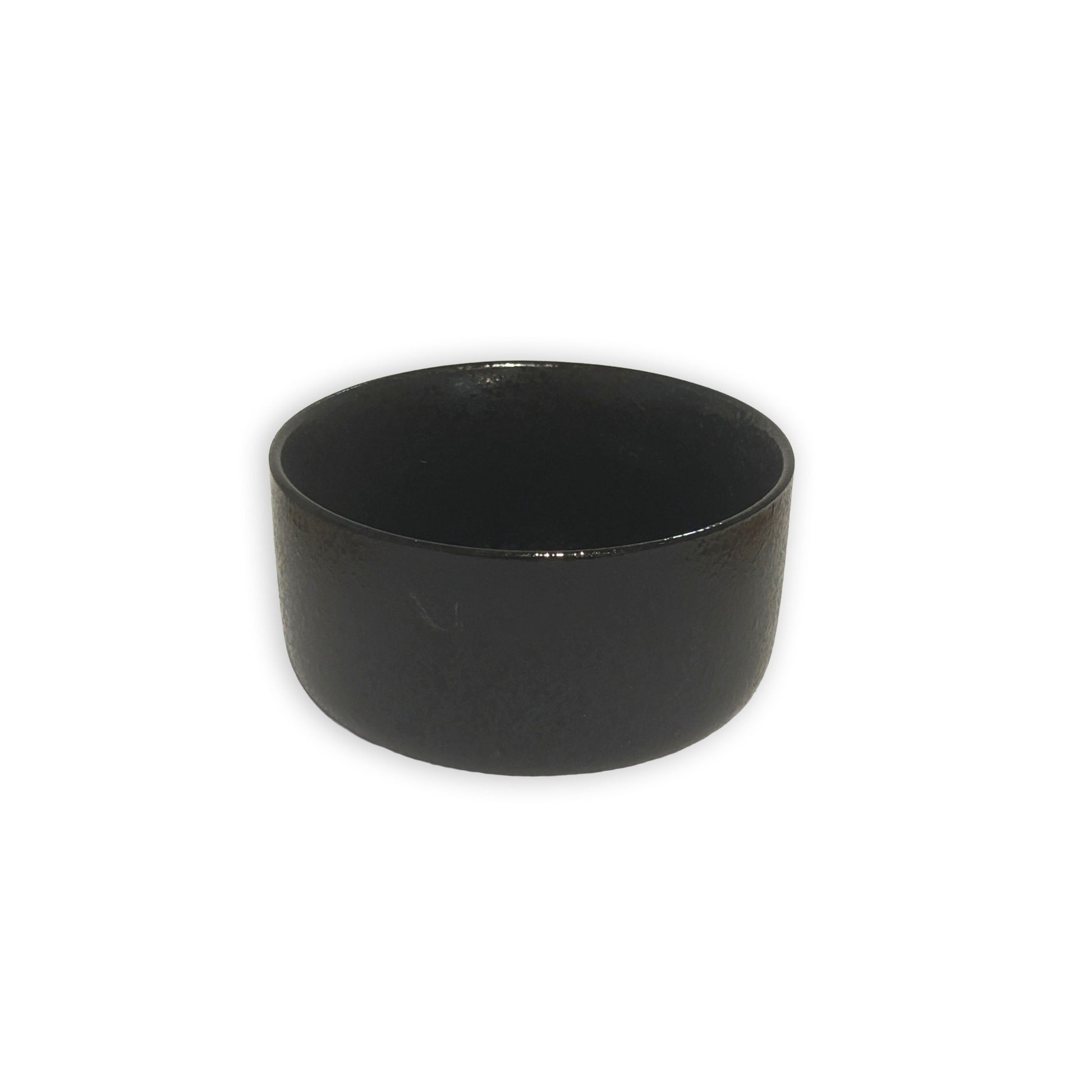 Black ceramic bowl on a white background