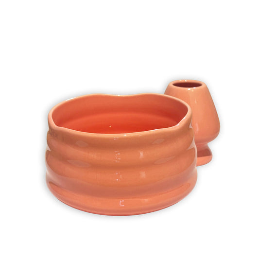 Terracotta matcha bowl with ribbed texture on a white background