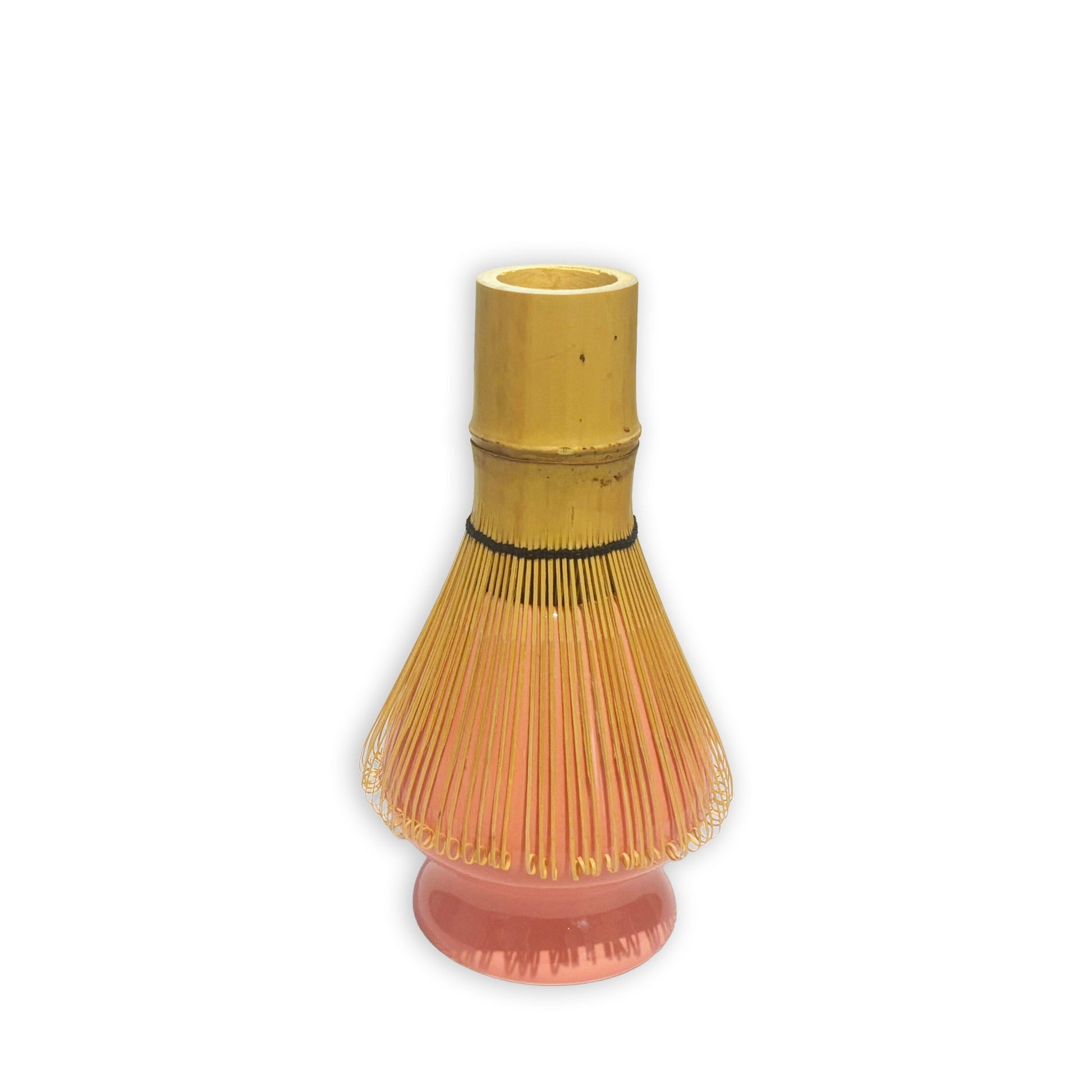 Bamboo whisk with wooden handle on a white background